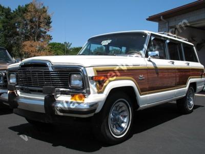 This is not mine, though it looks just like my old white 1984 Grand Wagoneer... except this restored model is worth $24,000 and mine, after being wrecked and sitting for 10 years, was sold for $1. 