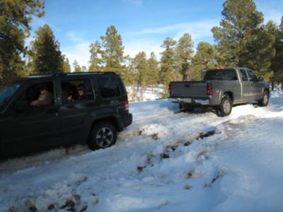 Chevy Truck Pulling Out A Jeep That Got Stuck In Snow