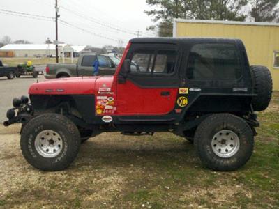 Update picture with new 15x10 rims and 35/12.50/15 tires with the hard top on.