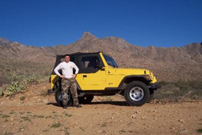  Here's a picture of my boyfriend next to the Jeep. 